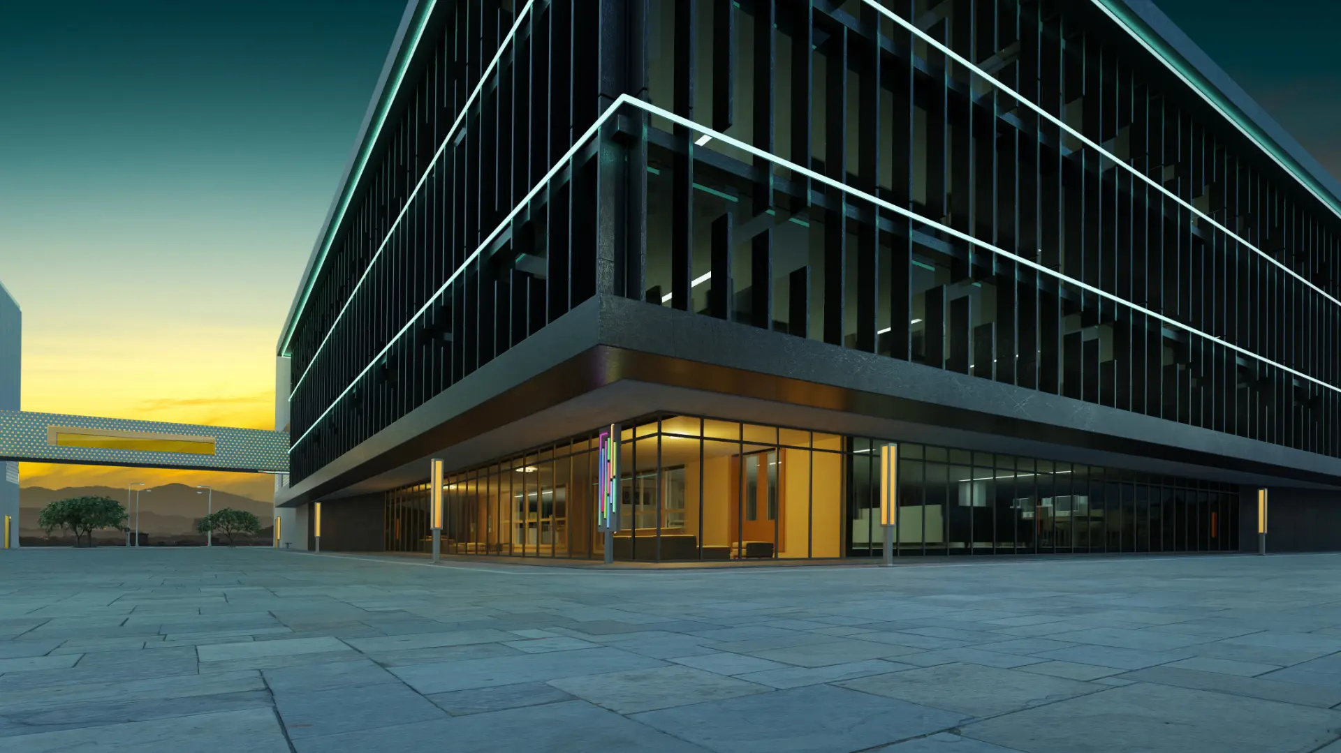 Edifício corporativo moderno com fachada de vidro iluminada ao anoitecer